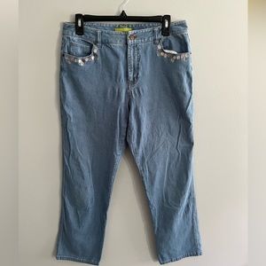 Size 8 straight leg jeans with floral decal on pockets.